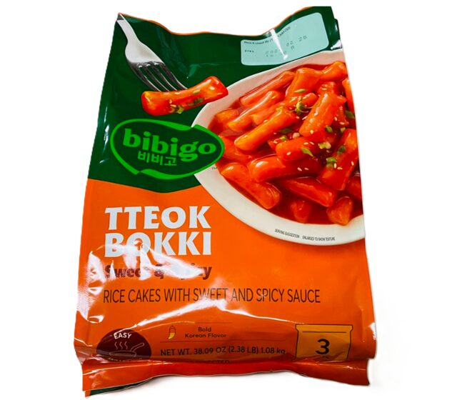 CJ bibigo トッポッキ 2人前×3袋（1,080g）の商品パッケージ。韓国風甘辛ソース付きの冷蔵トッポッキセット。オレンジと緑を基調としたデザインで、トックと調味料の写真が表示されている。